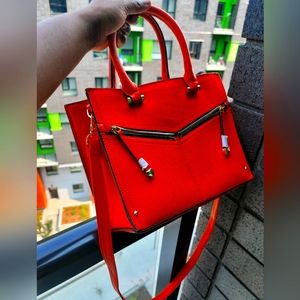 Orange and black call it spring handbags